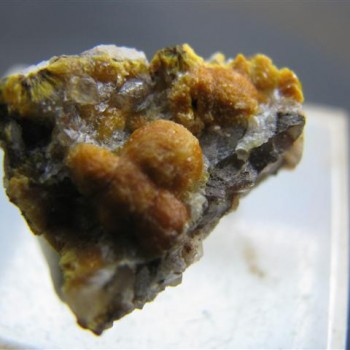 rhomboidal mineral specimen of boltwoodite